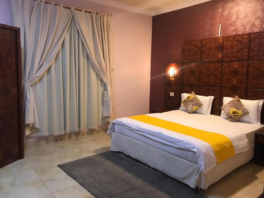 מיטה או מיטות בחדר ב-رانا الخليجية - rana alkhaleejiah