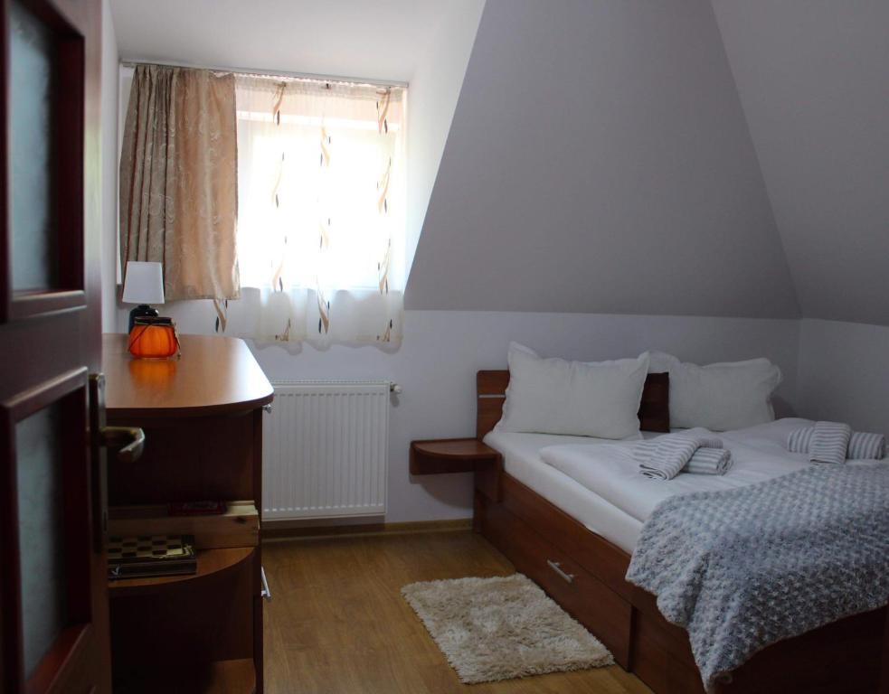 Postel nebo postele na pokoji v ubytování Napsugár Vendégház