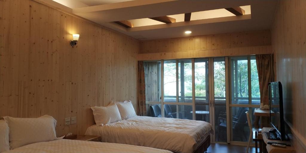 Dragon Manor Resort - Chambre Quadruple De Luxe