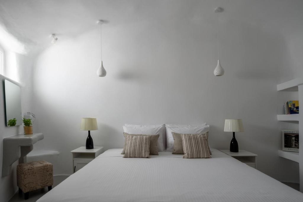 Postel nebo postele na pokoji v ubytování White Dream Suites