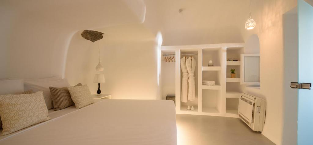 Postel nebo postele na pokoji v ubytování White Dream Suites