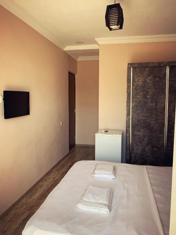 Postel nebo postele na pokoji v ubytování Hotel Crown
