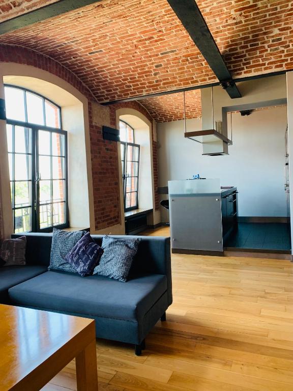 Kuchyňa alebo kuchynka v ubytovaní Apartament Stara Przędzalnia