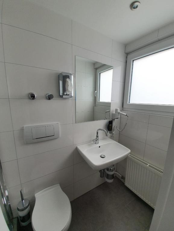 Koupelna v ubytování Hotel BaWü