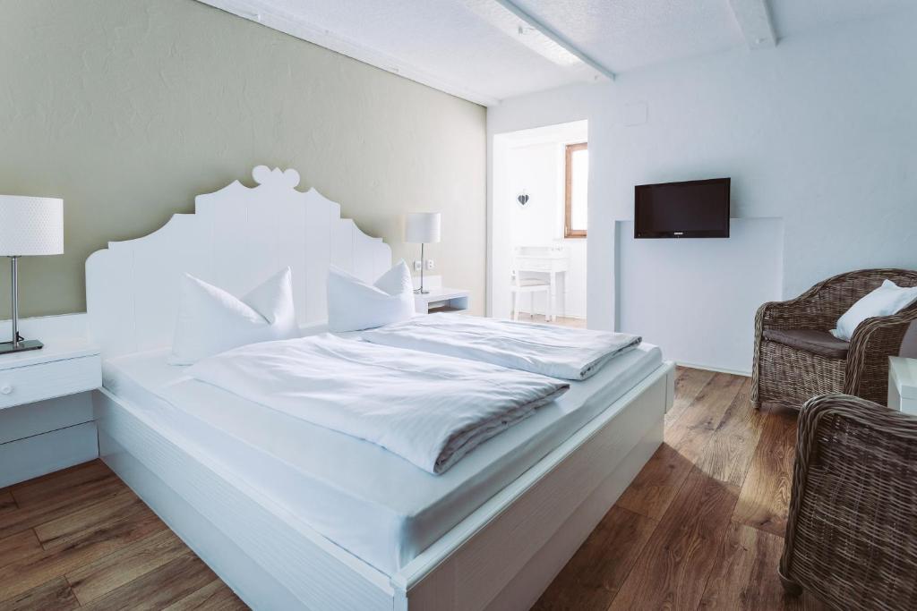 Postel nebo postele na pokoji v ubytování Der Bären in Zell
