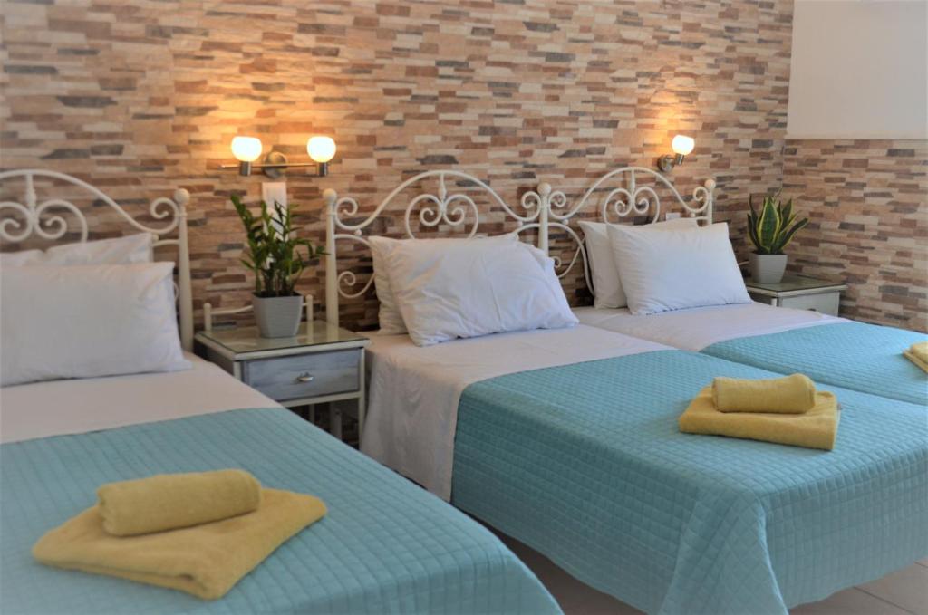 Postel nebo postele na pokoji v ubytování Hotel Kastro