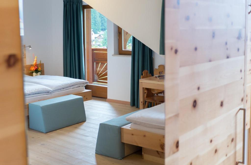 Postel nebo postele na pokoji v ubytování Hotel Feldrand