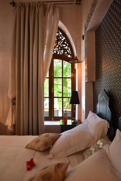 Postel nebo postele na pokoji v ubytování Demeures d'Orient Riad & Spa