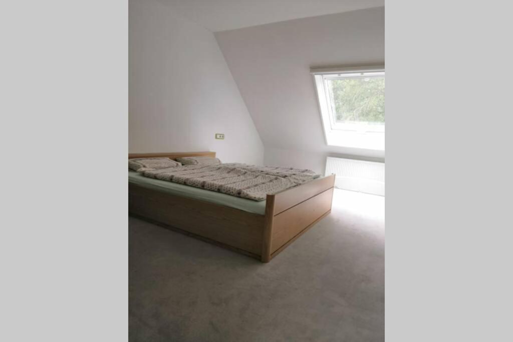 Postel nebo postele na pokoji v ubytování Bohmte Zuhause mit Aussicht