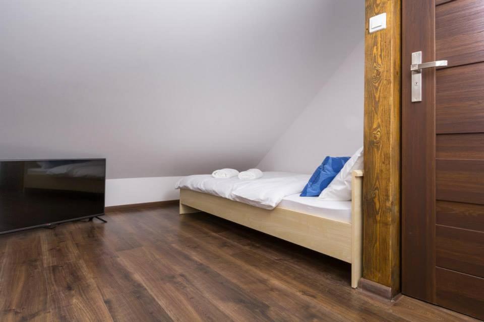Postel nebo postele na pokoji v ubytování Wschodzące Słońce
