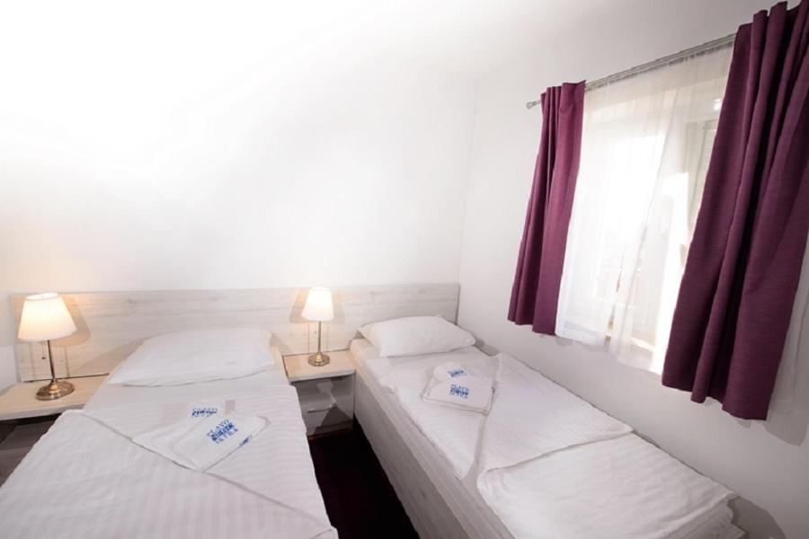 Postel nebo postele na pokoji v ubytování Plavo nebo Istra Apartments