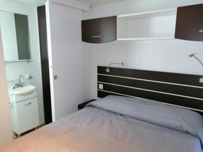 Postel nebo postele na pokoji v ubytování Camping Delfino