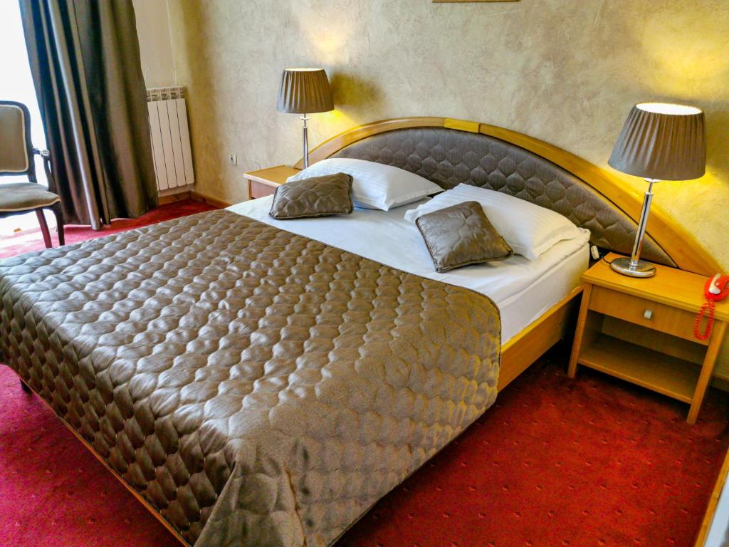 Postel nebo postele na pokoji v ubytování Hotel Belvedere