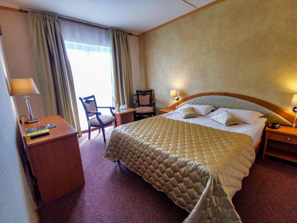 Postel nebo postele na pokoji v ubytování Hotel Belvedere