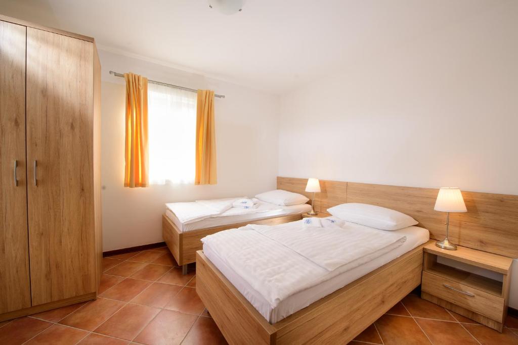Postel nebo postele na pokoji v ubytování Plavo nebo Istra Apartments