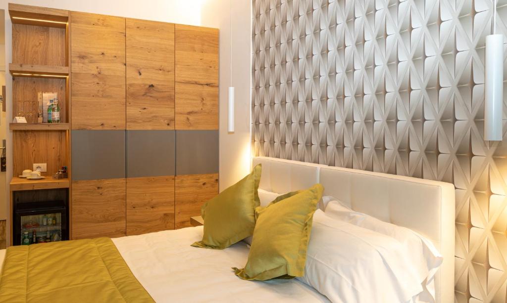 Posteľ alebo postele v izbe v ubytovaní Hotel Aurora