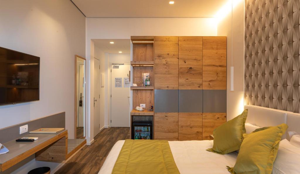 Posteľ alebo postele v izbe v ubytovaní Hotel Aurora