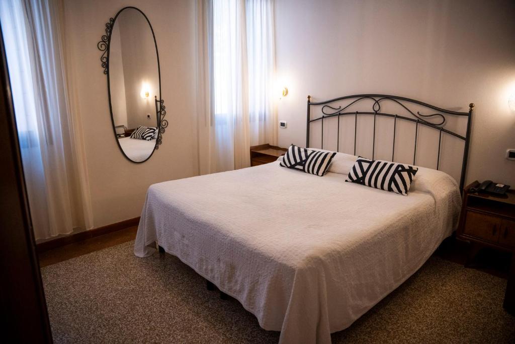Postel nebo postele na pokoji v ubytování Locanda Art Deco
