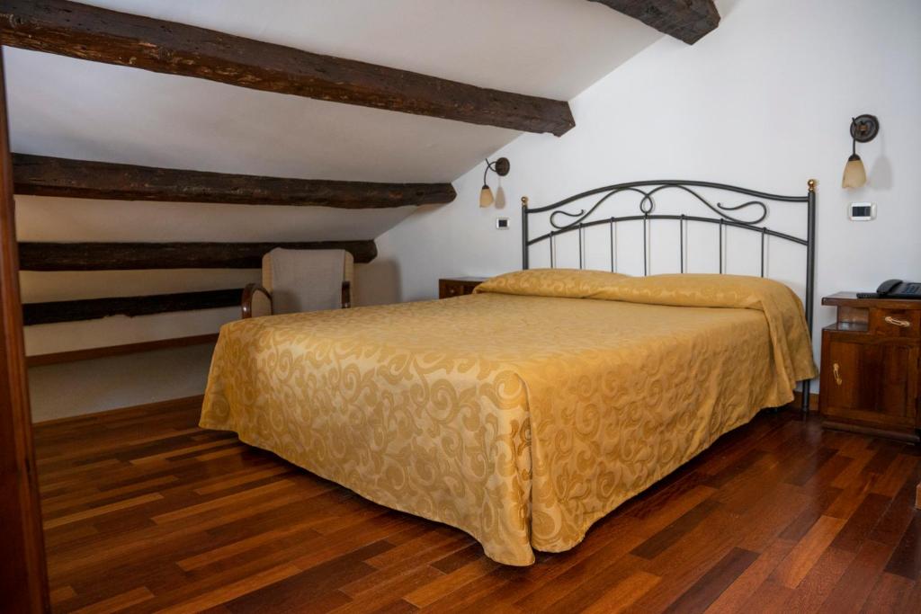 Postel nebo postele na pokoji v ubytování Locanda Art Deco
