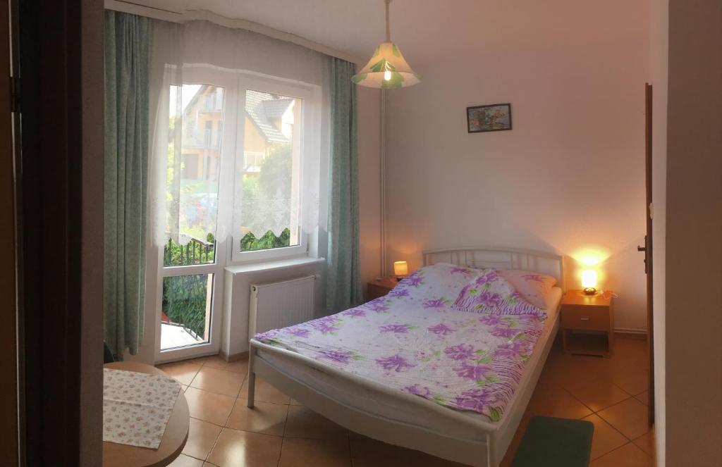 Postel nebo postele na pokoji v ubytování Dom Jana