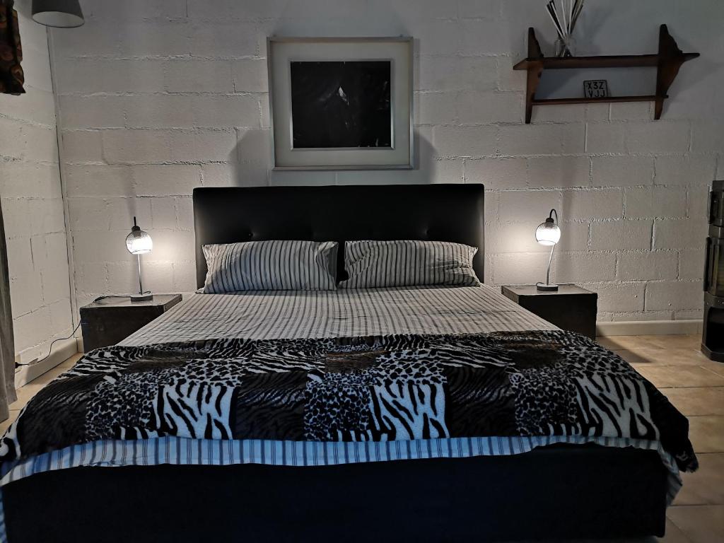 Posteľ alebo postele v izbe v ubytovaní LOFT collina vista mare