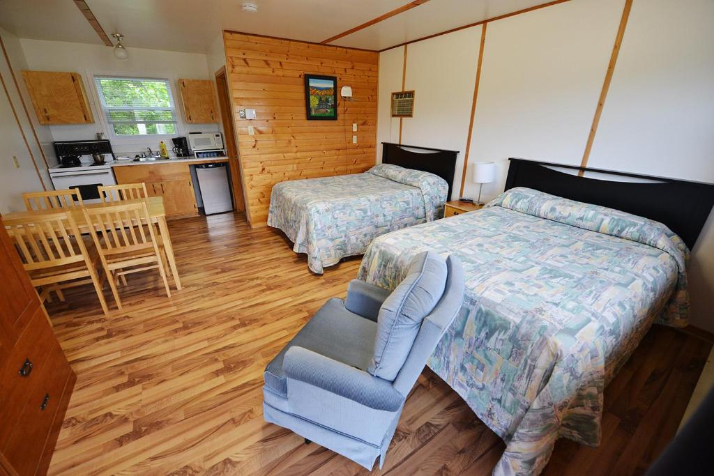 Postel nebo postele na pokoji v ubytování Sea Breeze Cottages