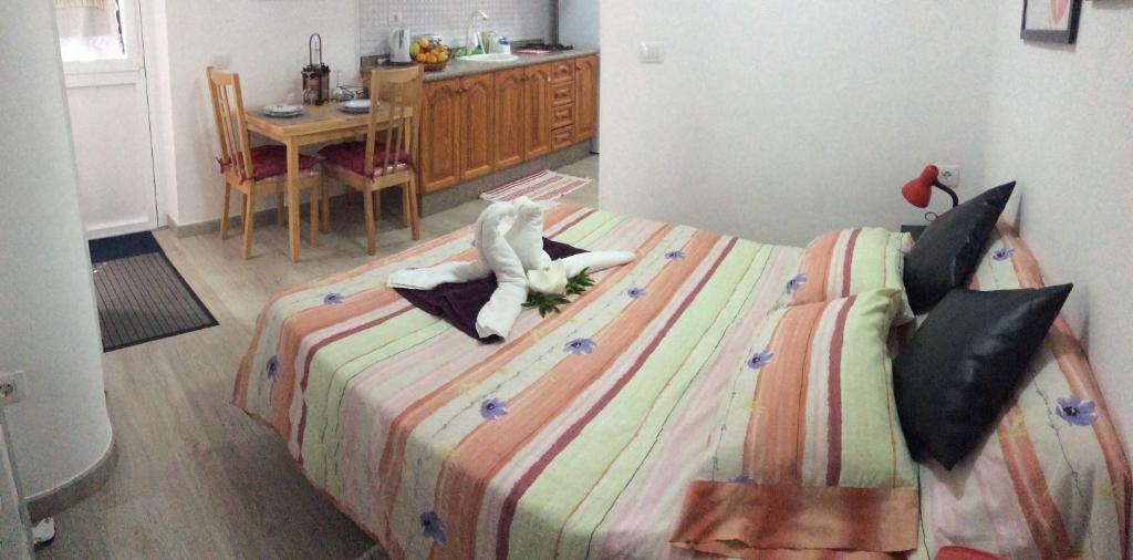 a bedroom with a bed with a stuffed animal on it at Estudio La Esperanza in La Esperanza