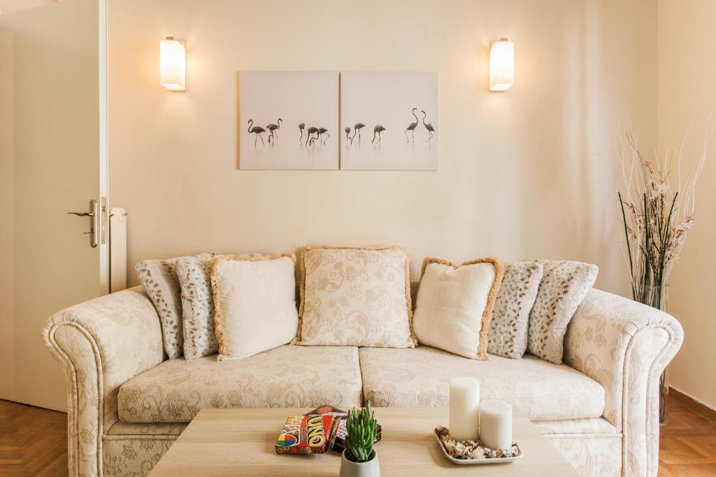 a living room with a couch and a table at La casa di Plaka in Athens