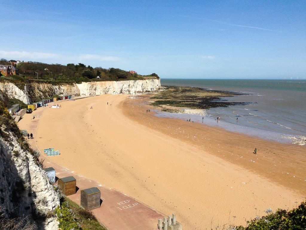 a view of a beach with people on it at Seaview - Cheviot Court in Broadstairs