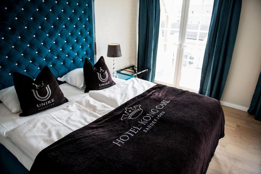 Postel nebo postele na pokoji v ubytování Hotel Kong Carl - Unike Hoteller