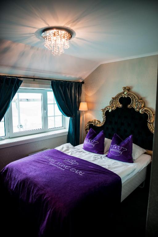 Postel nebo postele na pokoji v ubytování Hotel Kong Carl - Unike Hoteller
