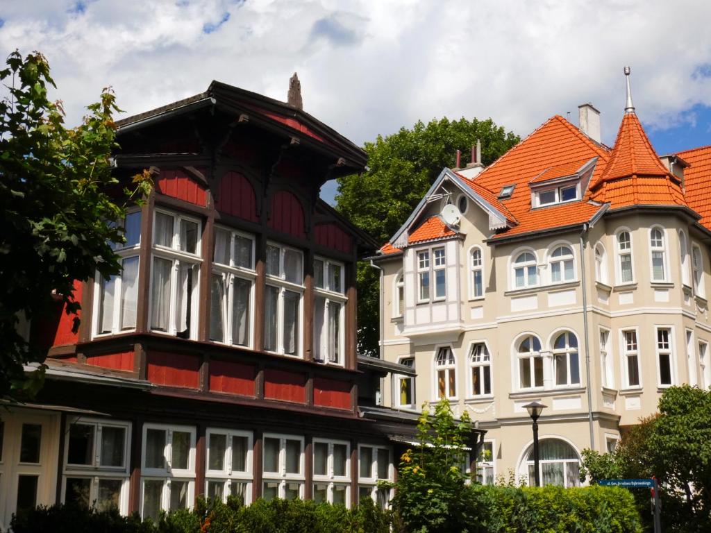 a group of buildings with orange roofs at Apartament ze słoneczną werandą -250 m do plaży in Sopot
