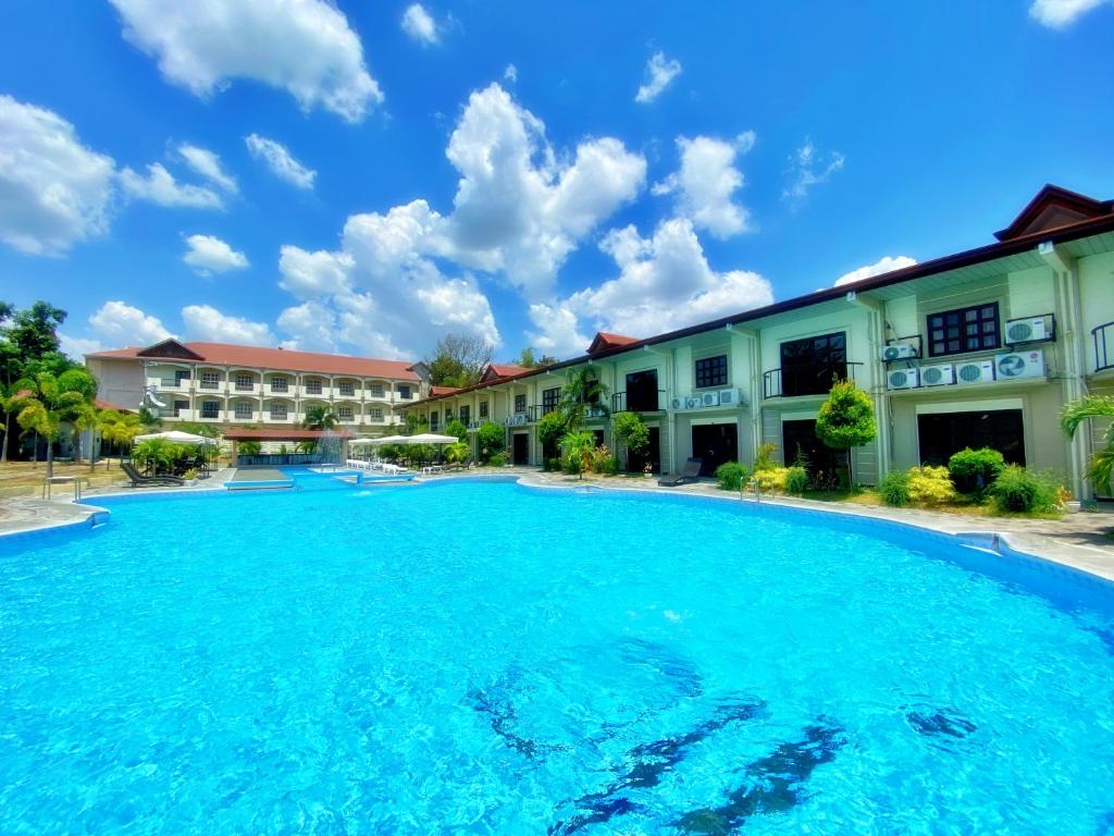 a large swimming pool in front of some buildings at Angeles Palace Hotel in Angeles