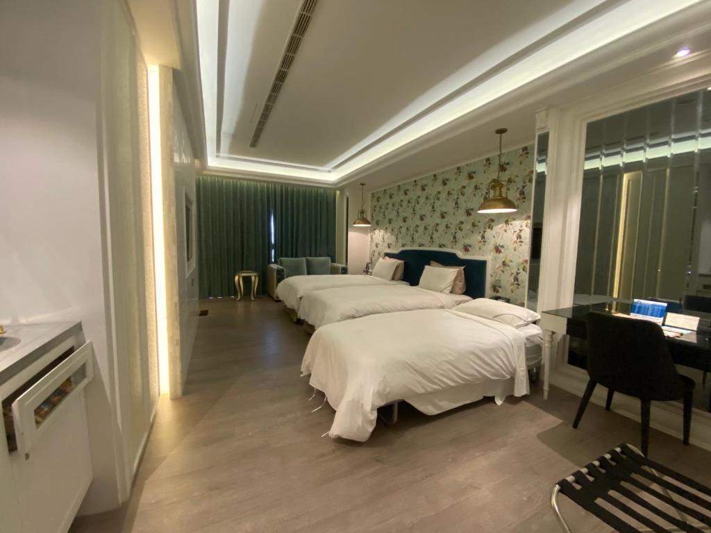 Katil atau katil-katil dalam bilik di U-Her Hotel