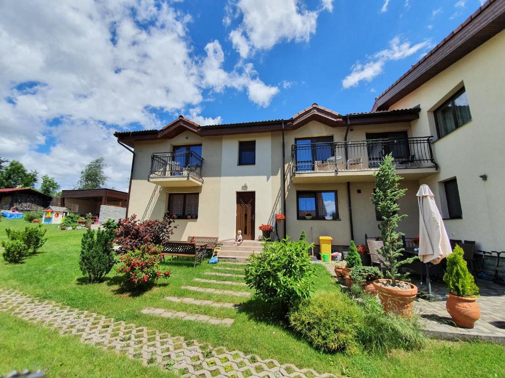 a large house with a yard in front of it at Privat Bartky in Vrbov