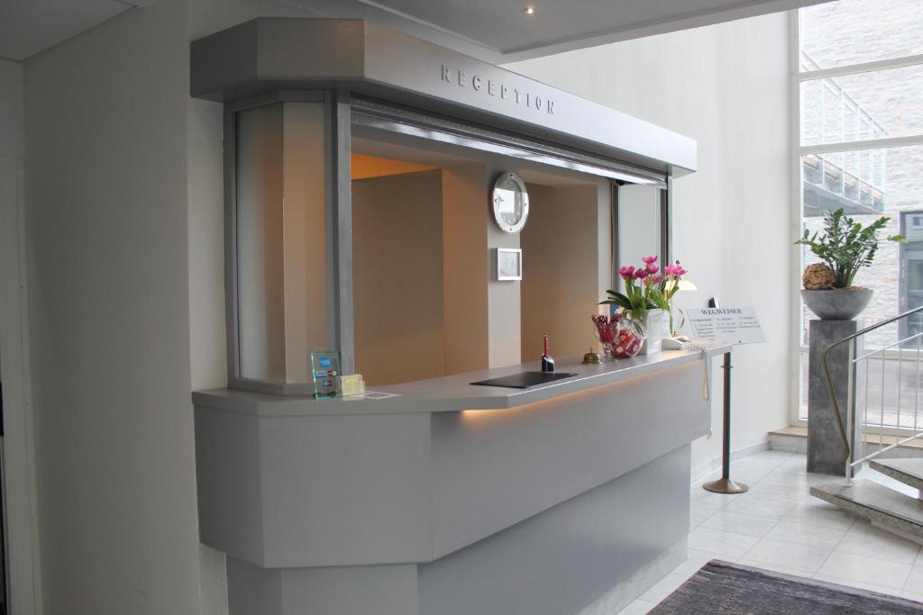 Kuchyň nebo kuchyňský kout v ubytování Stadthotel Geis