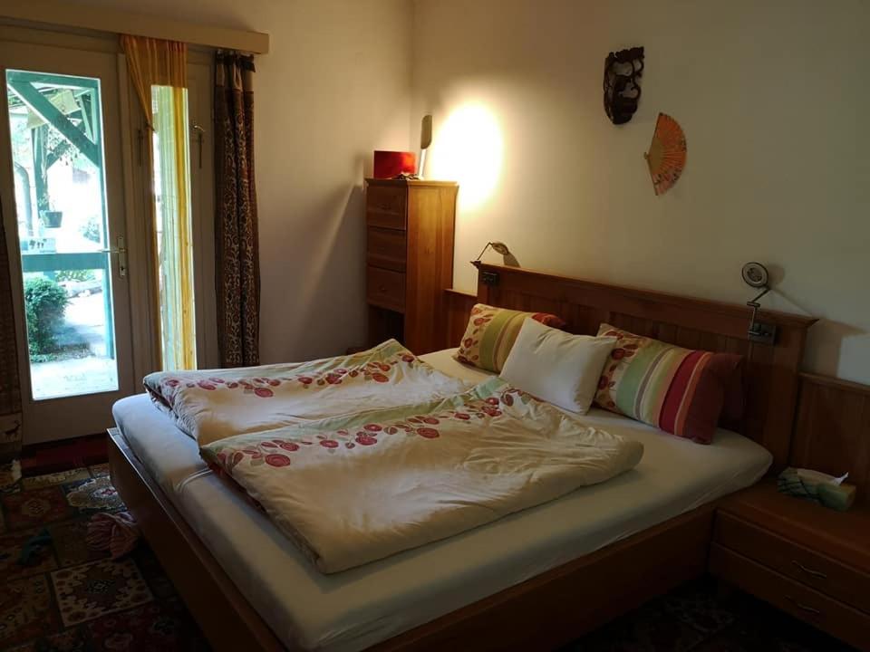 Llit o llits en una habitació de Nyugalomsziget