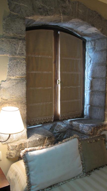 Postel nebo postele na pokoji v ubytování Abadia del Pirineo