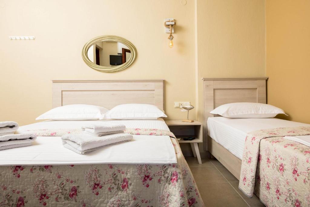 Postel nebo postele na pokoji v ubytování Pension Sotiria