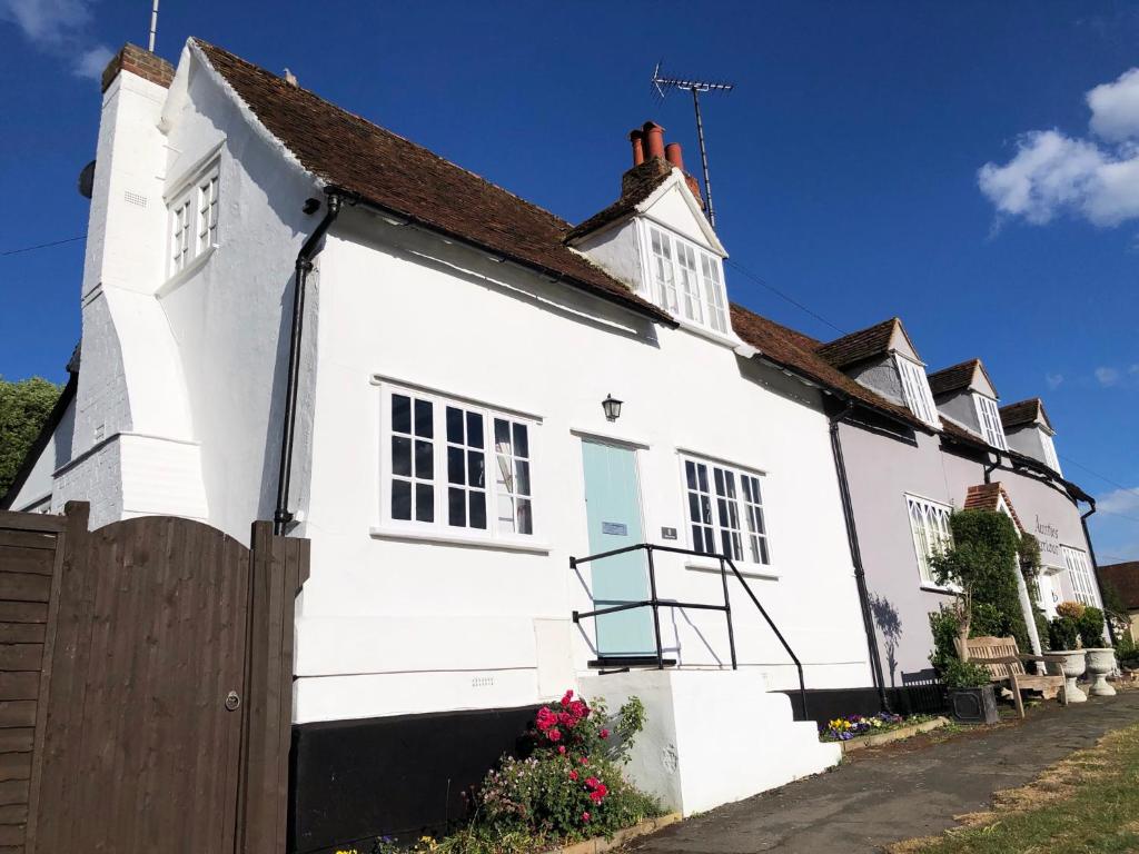 a white house with a brown roof at Millie's Cottage in Finchingfield