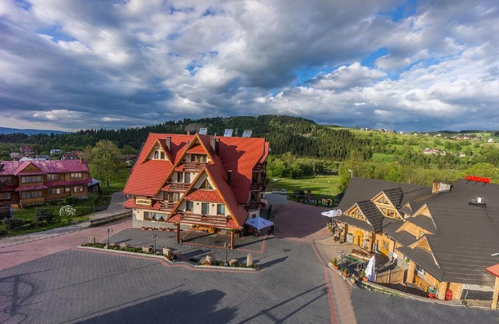 an aerial view of a large house with red roofs at Dom Wypoczynkowy U Chramca in Białka Tatrzańska