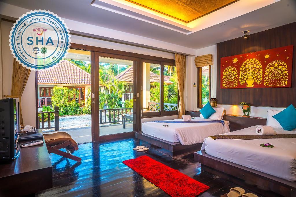 Postel nebo postele na pokoji v ubytování Am Samui Resort Taling Ngam