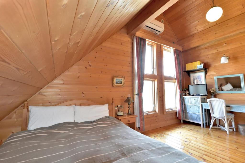 Postel nebo postele na pokoji v ubytování Carrefour Guesthouse カルフール ゲストハウス