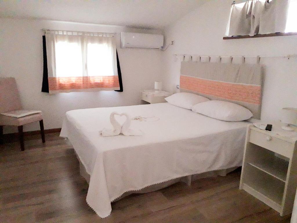 Postel nebo postele na pokoji v ubytování B&B I Limoni