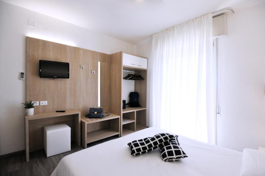 Postel nebo postele na pokoji v ubytování Hotel Etna
