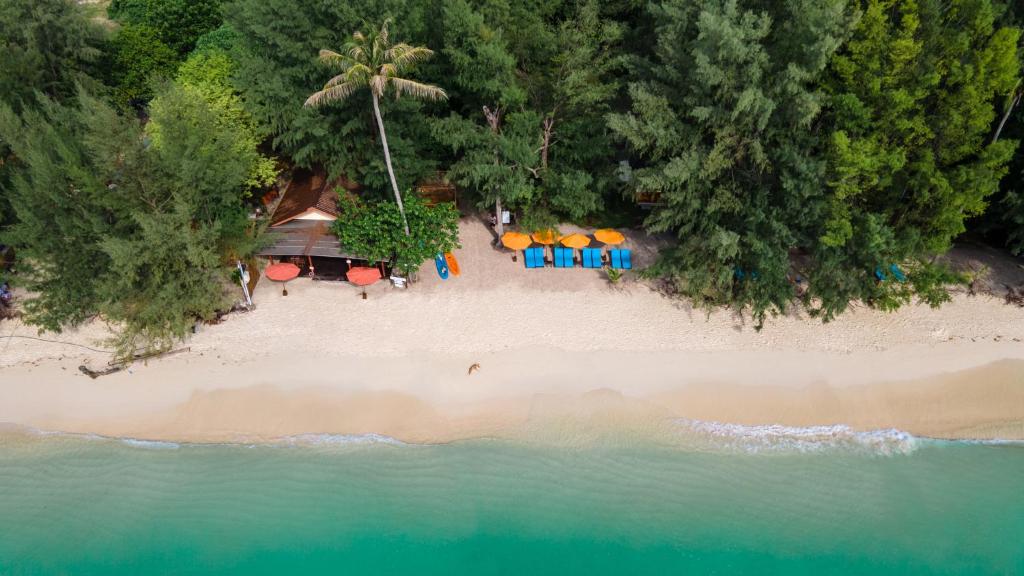 an aerial view of a beach with chairs and umbrellas at Wapi Resort in Ko Lipe