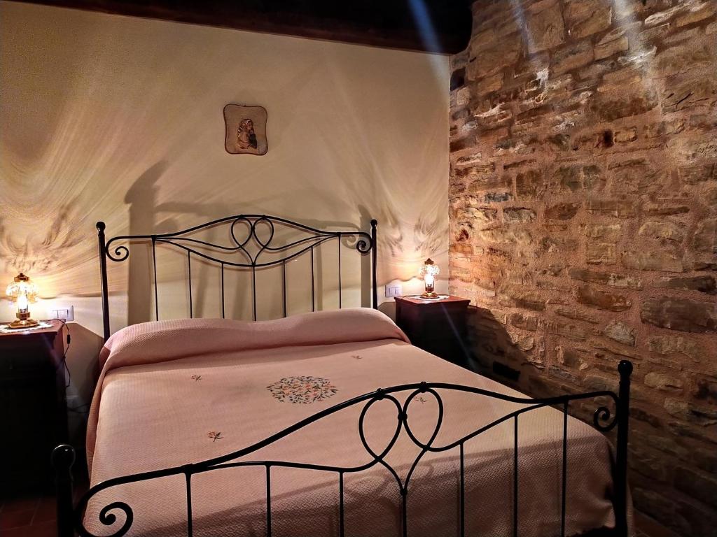 Postel nebo postele na pokoji v ubytování Frigino Agriturismo