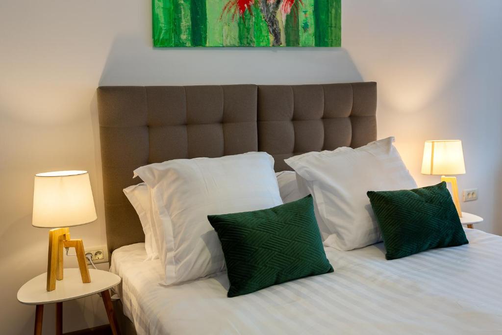 Postel nebo postele na pokoji v ubytování Lagom Hotel