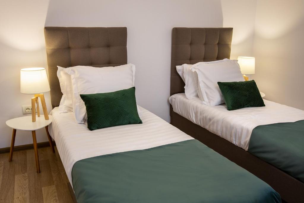 Postel nebo postele na pokoji v ubytování Lagom Hotel