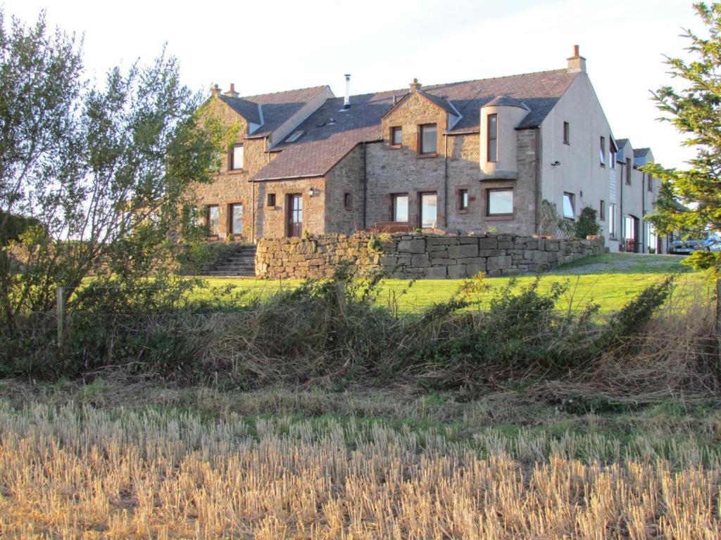 a large house on a grassy field at Kescoweth in Montrose